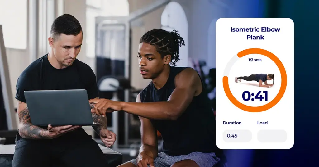 Fitness coach reviewing a client's file on a laptop, with a timed isometric plank exercise in Hexfit